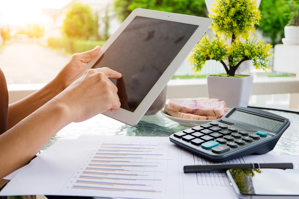 Image of ipad, calculator and accounting documents